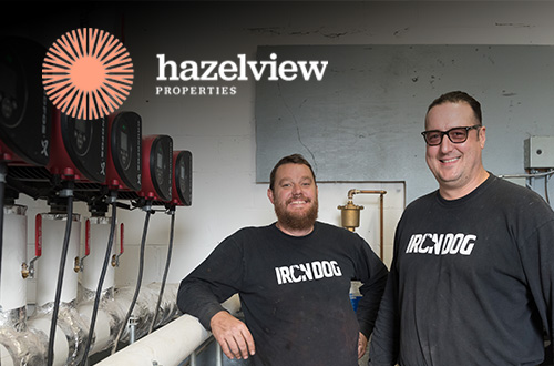 two Iron Dog technicians with Hazelview Properties logo